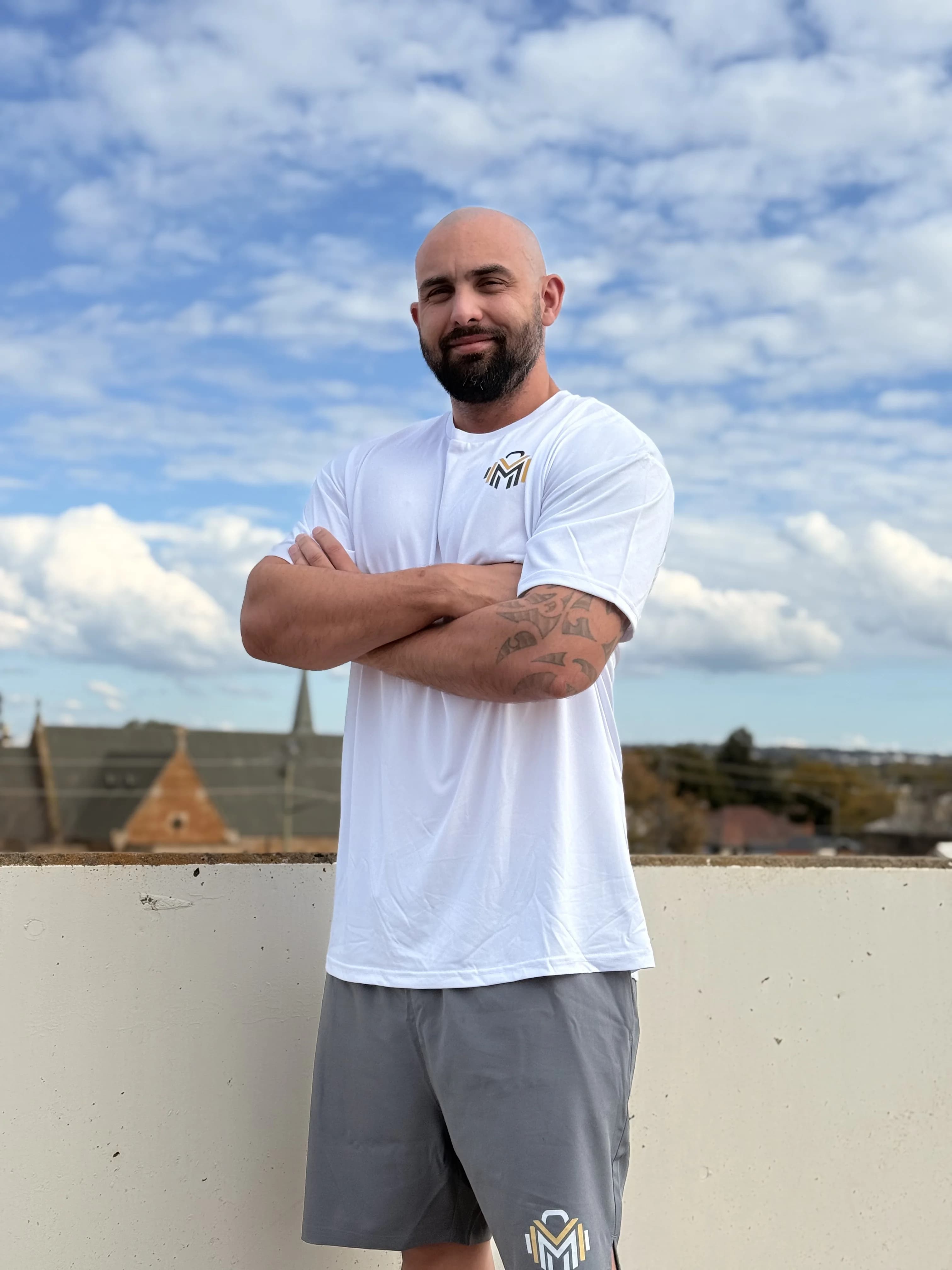 James standing in the gym after his 30kg transformation.